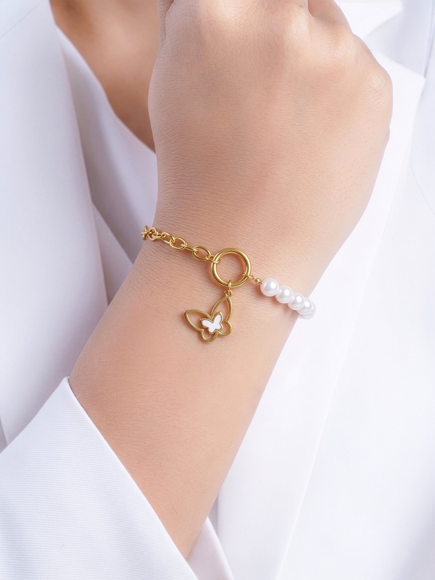 Tivya Butterfly Pearl Dangling Butterfly
Charm, White Pearl Bead 18K Gold Plated Charm Women's Bracelet