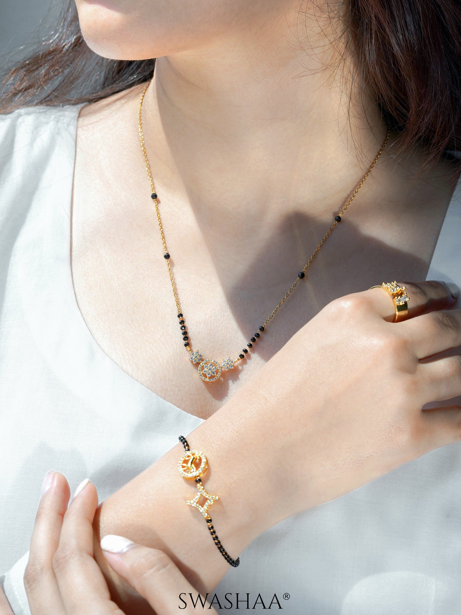 Vrashi Shimmering Cubic Zirconia Diamond Charms 18K Gold Plated Mangalsutra
Charvi Circular Horse Medallion Diamond Shaped Charms 18K Gold Plated Mangalsutra Bracelet