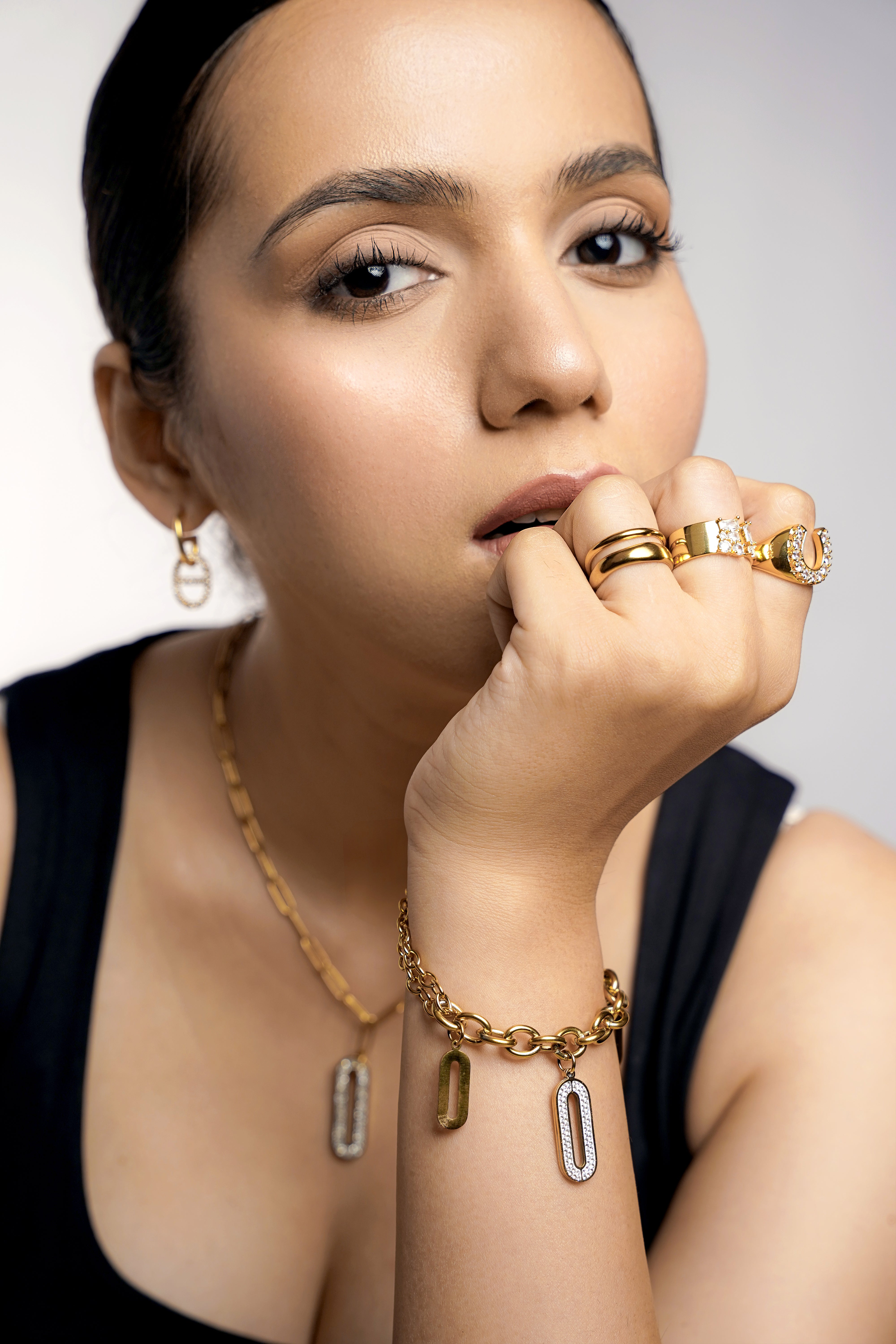 Roha Link Oval Shaped Dangling Diamond Charms 18K Gold Plated Bracelet, Zoey Dual Band Space Adjustable 18K Gold Plated Ring, Kahvi Baguette Round Cut CZ Diamond 14K Gold Plated Ring, Horseshoe Sparkling CZ Diamond 14K Gold Plated Ring