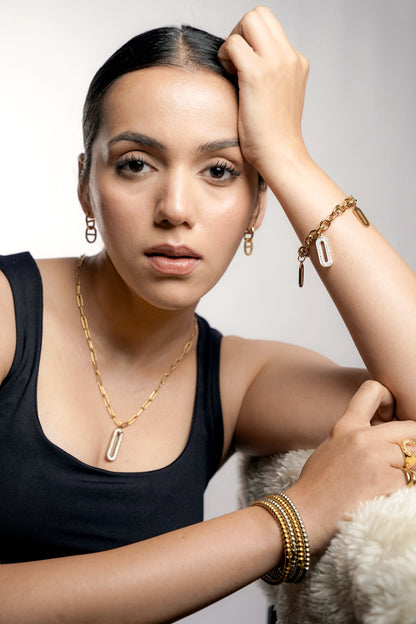 Vega Geometric Cutout Diamond 18K Gold Plated Drop Earrings-Mercy Round Bead Band Bracelet Multicolor Set-Roha Link Oval Shaped Dangling Diamond Charms 18K Gold Plated Bracelet-Roha Link Diamond 18K Gold Plated Chain Pendant Necklace-Zoey Dual Band Space Adjustable 18K Gold Plated Ring